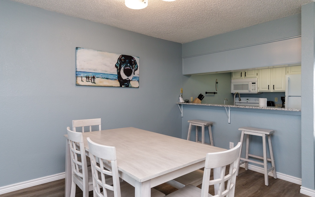 Your bright dining space flows seamlessly into the fully equipped kitchen, perfect for family meals and morning coffee.