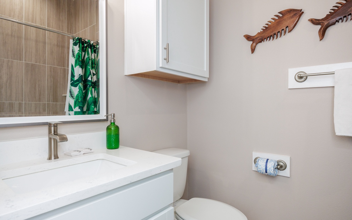 Step into your beautifully appointed bathroom with modern amenities and coastal-inspired decor that makes you feel right at home.