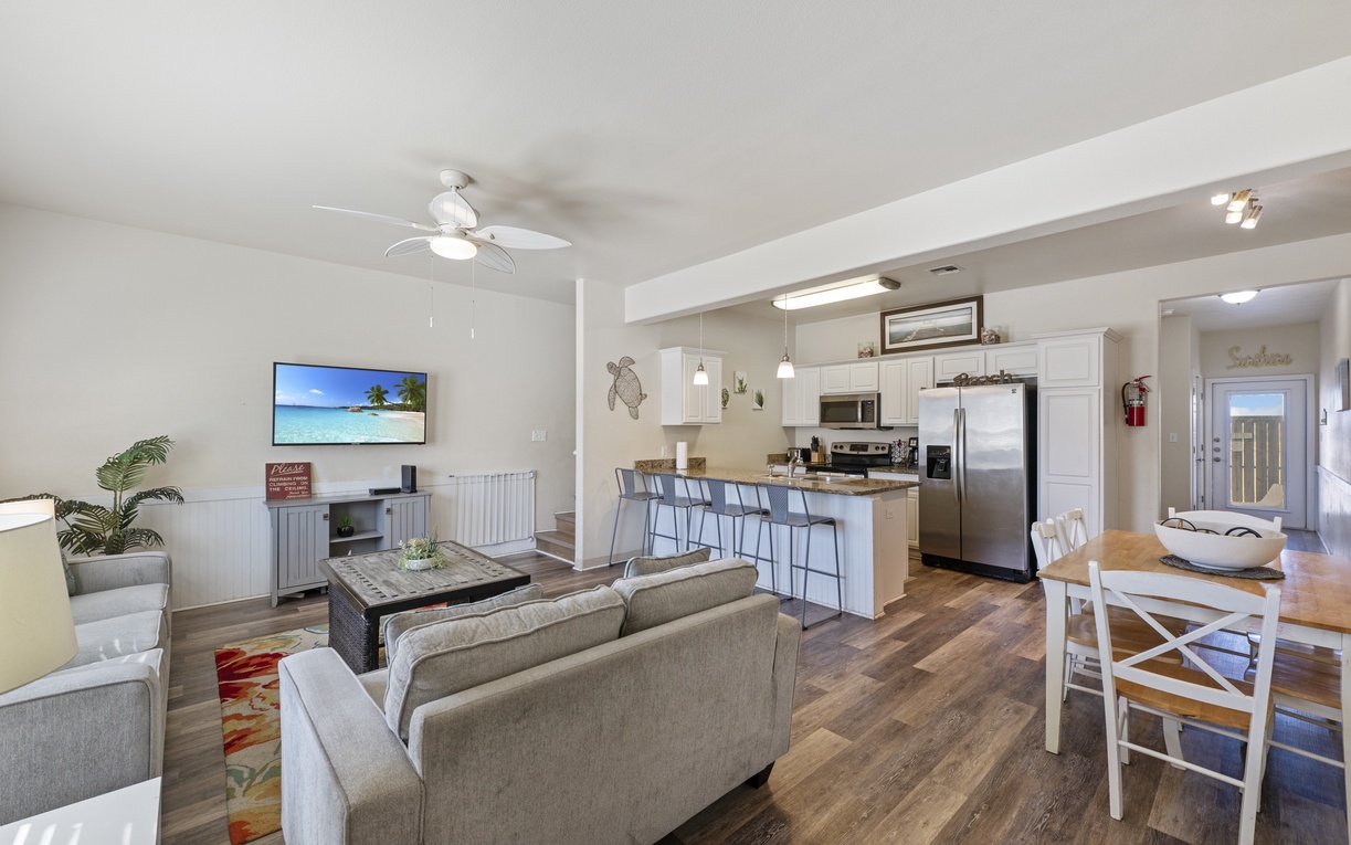 Your bright open-concept space seamlessly blends modern comfort with coastal charm, featuring a full kitchen and cozy living area perfect for relaxing.