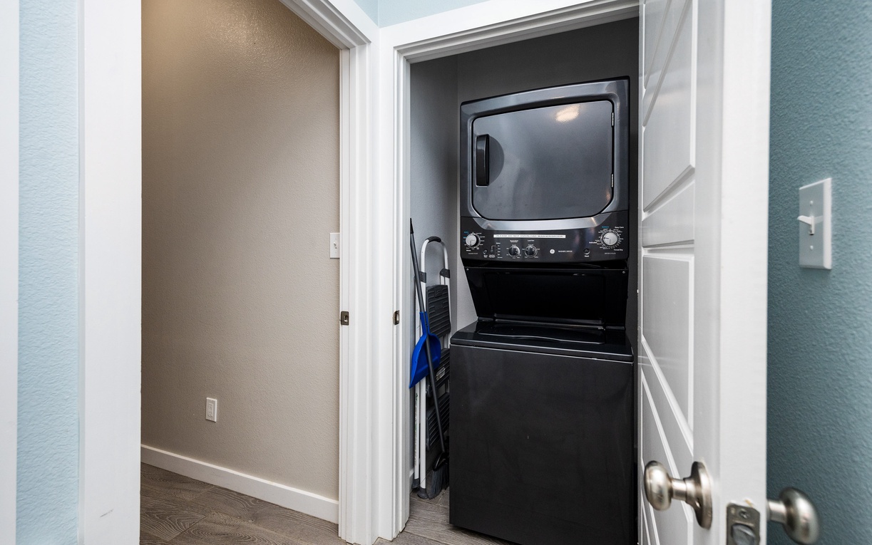 Your private laundry closet keeps you organized with a stacked washer and dryer for convenient in-unit washing.