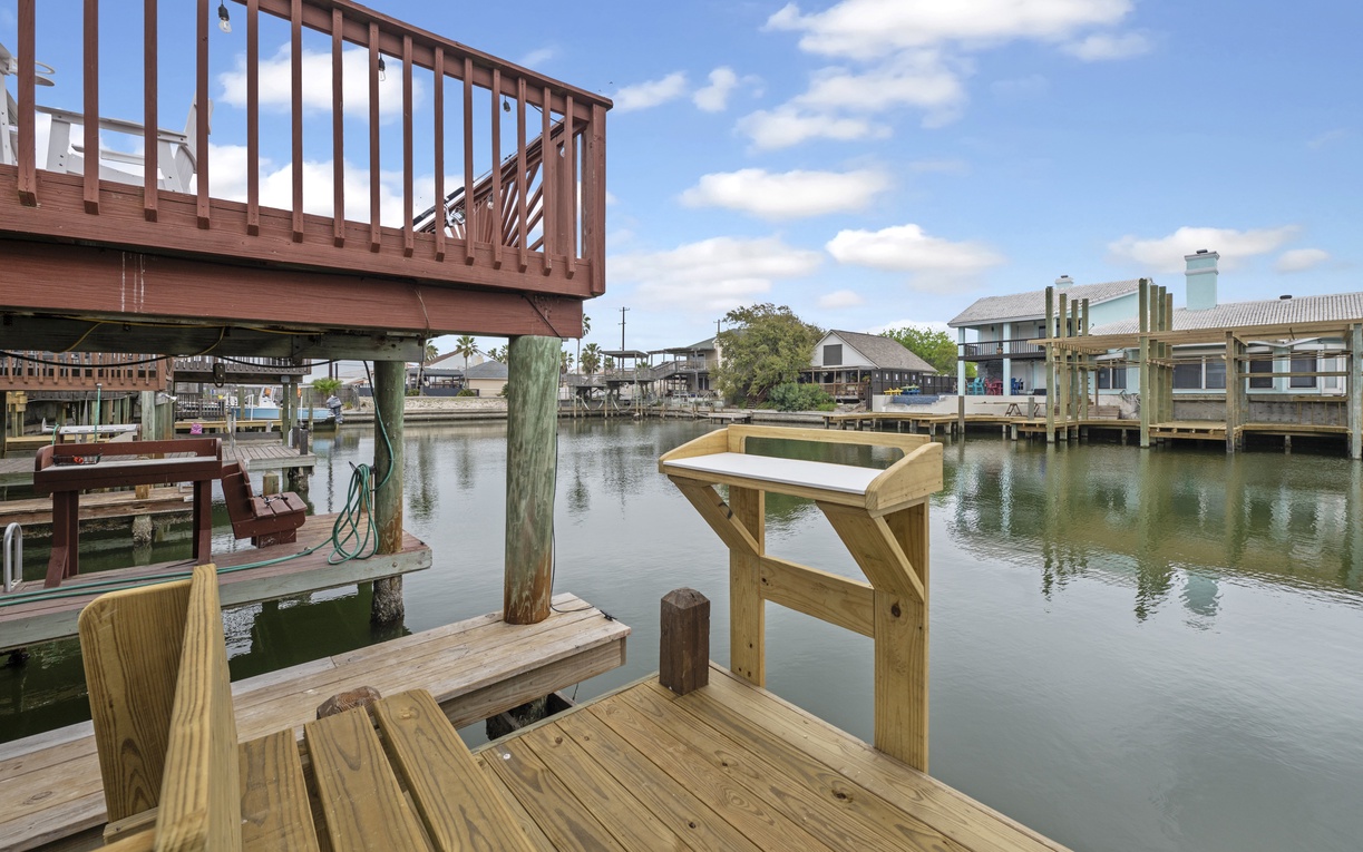Your private dock features a fish cleaning station and waterfront access, perfect for morning fishing adventures and evening canal views.