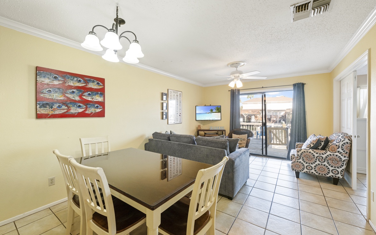 Your bright, open living space features comfortable seating and a dining table, perfect for relaxing after beach days.