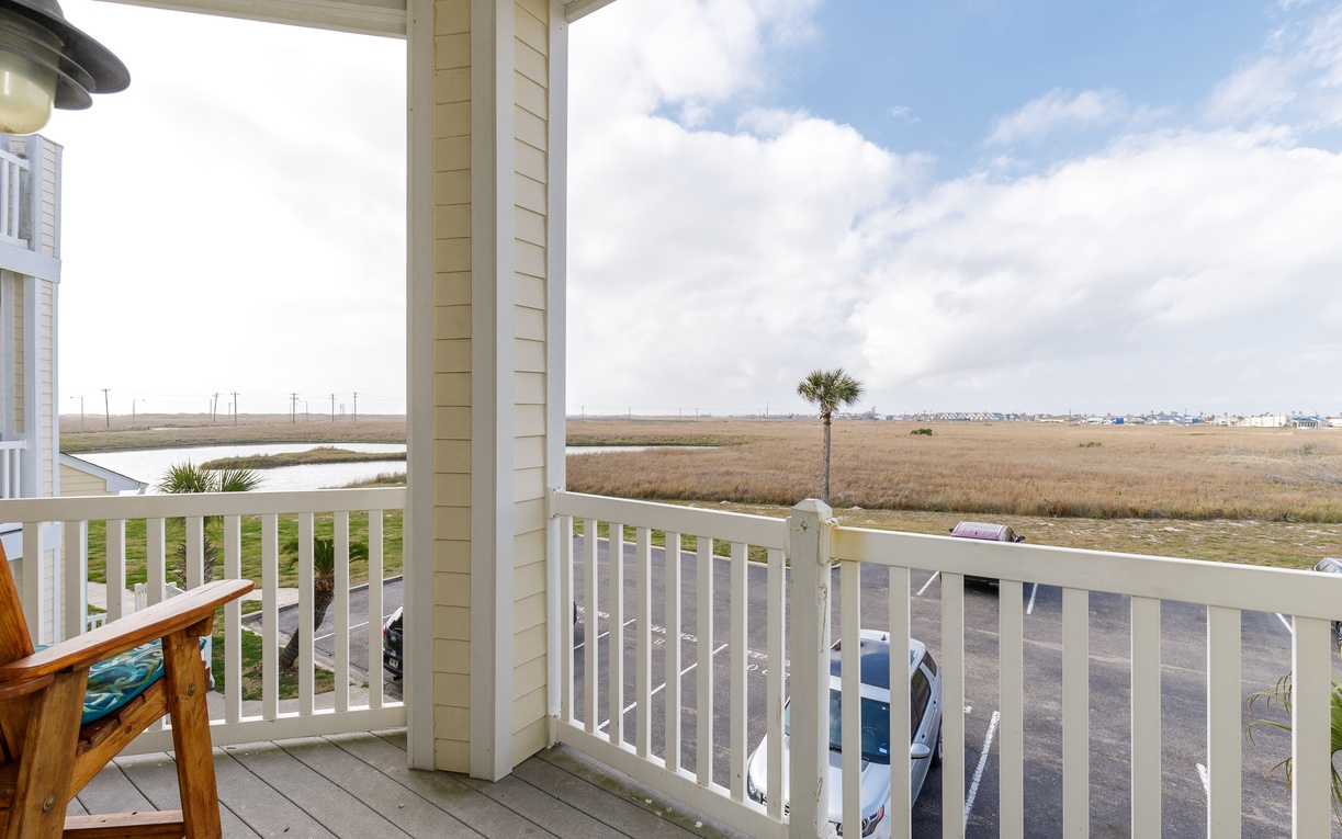 Relax on your private covered balcony while taking in peaceful marsh and coastal views stretching to the horizon.