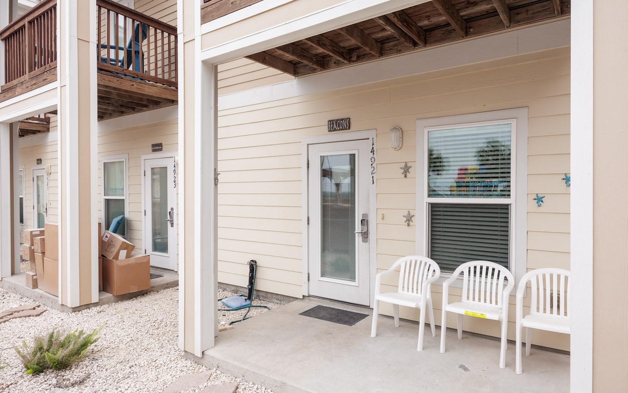 Your private covered patio awaits with comfortable seating where you can unwind and enjoy the peaceful surroundings.