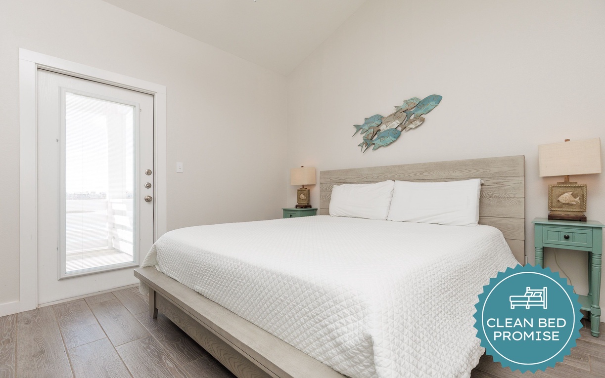 Drift off in this serene bedroom with crisp white linens and coastal charm that'll make you feel right at home.