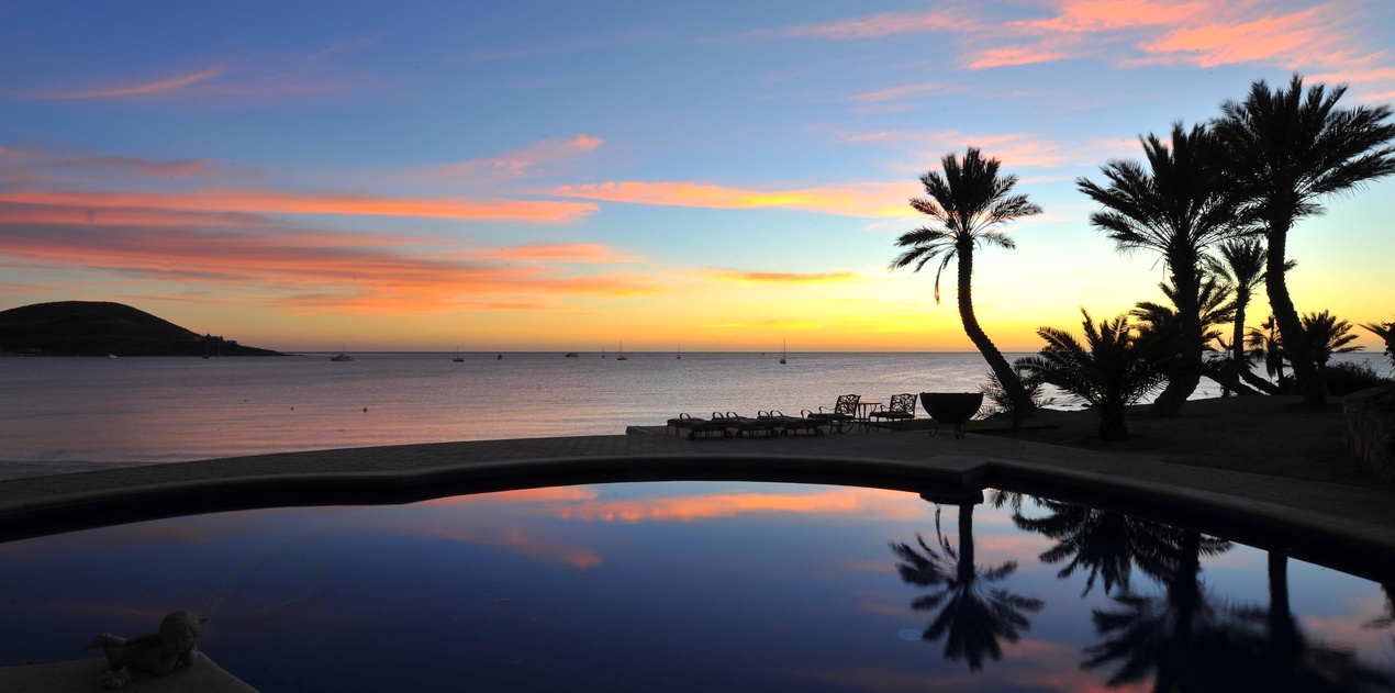 Pool with beautiful ocean view at sunset