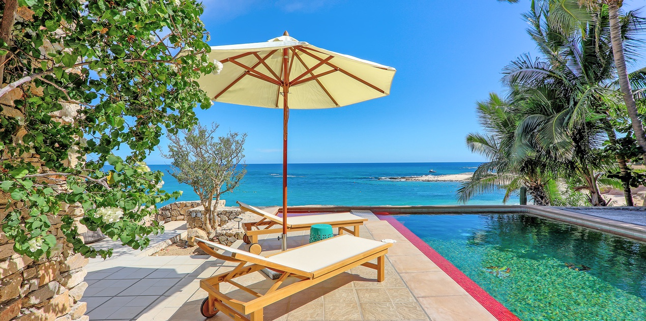 Patio with pool and beach view