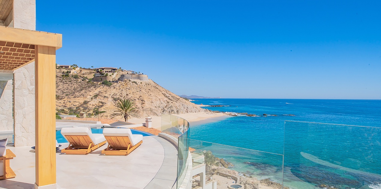 Sunny patio with amazing ocean and beachfront views
