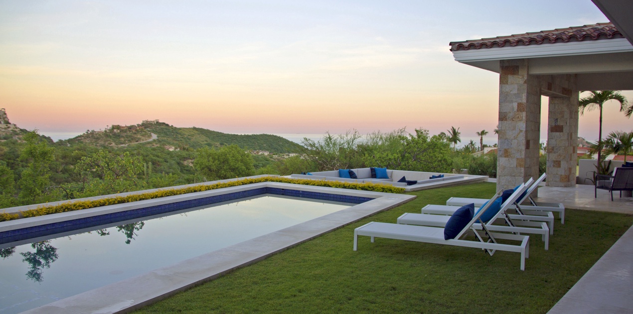 Pool with ocean view during sunset