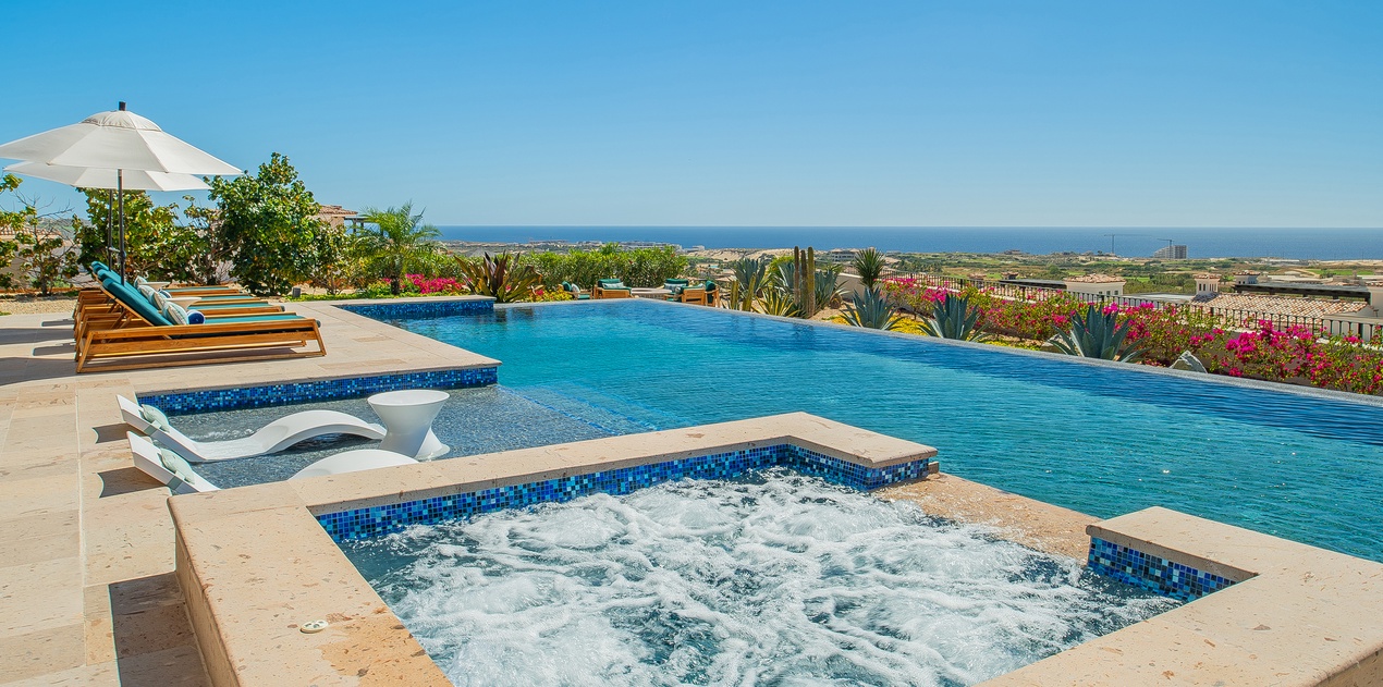 Soak in your private hot tub while gazing at endless ocean views, then cool off in the infinity pool.