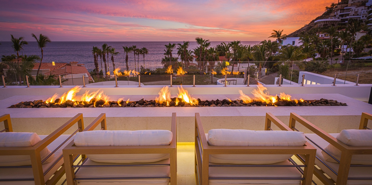 Firepit seating with ocean view during sunset