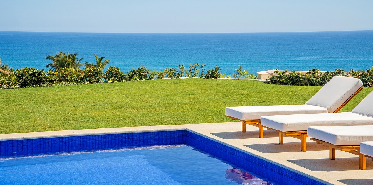 Sunny poolside with incredible ocean views