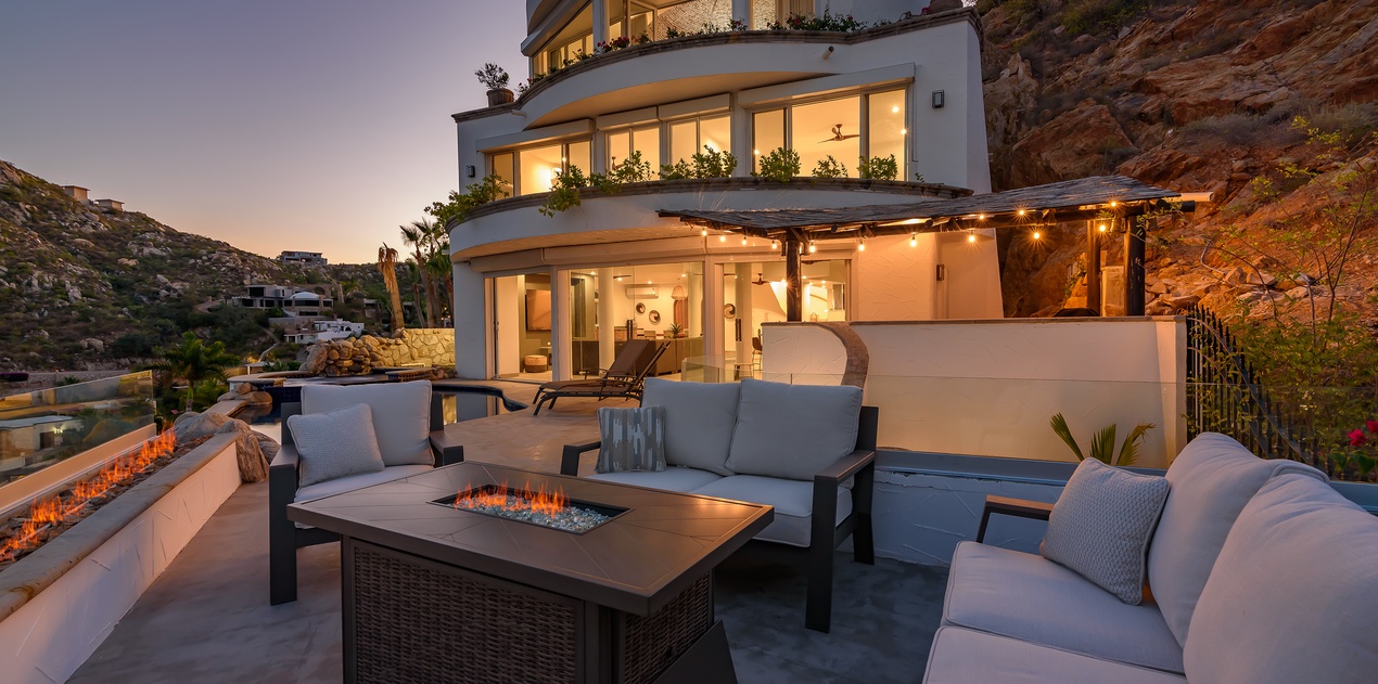 Sit by the cozy fire during sunset