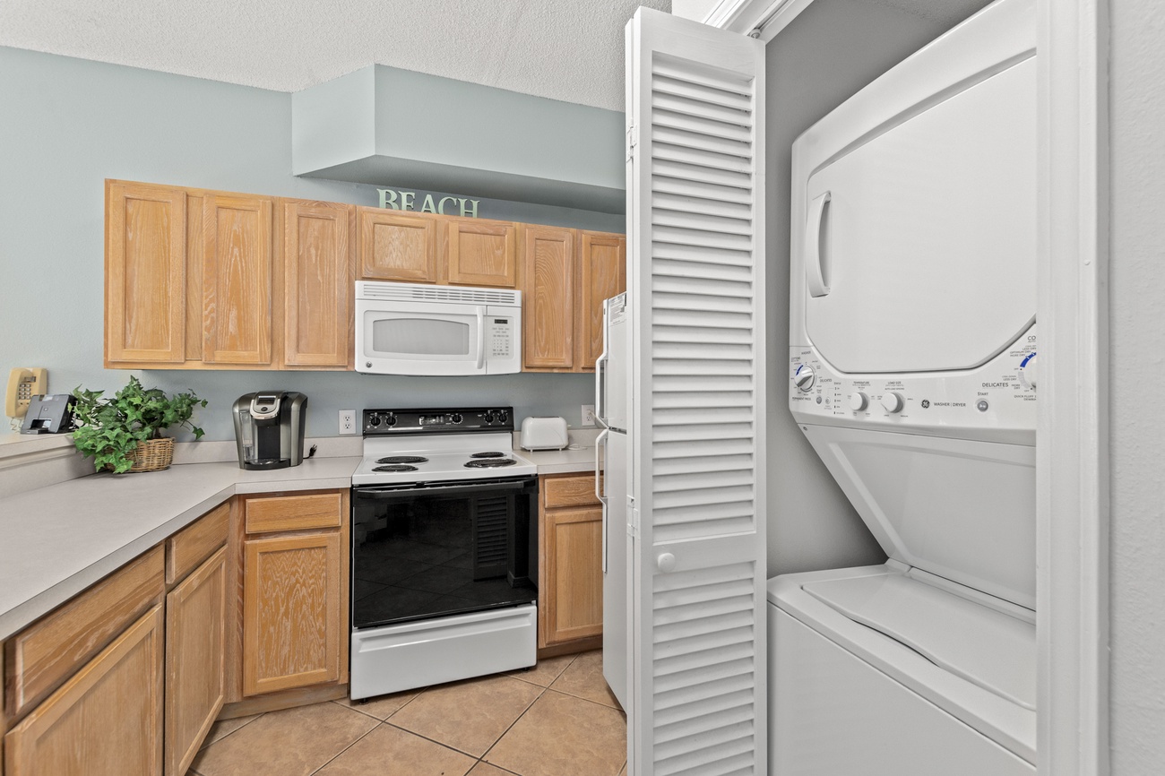 Your beach-themed kitchen comes equipped with everything you need, plus convenient in-unit washer and dryer for effortless vacation laundry.