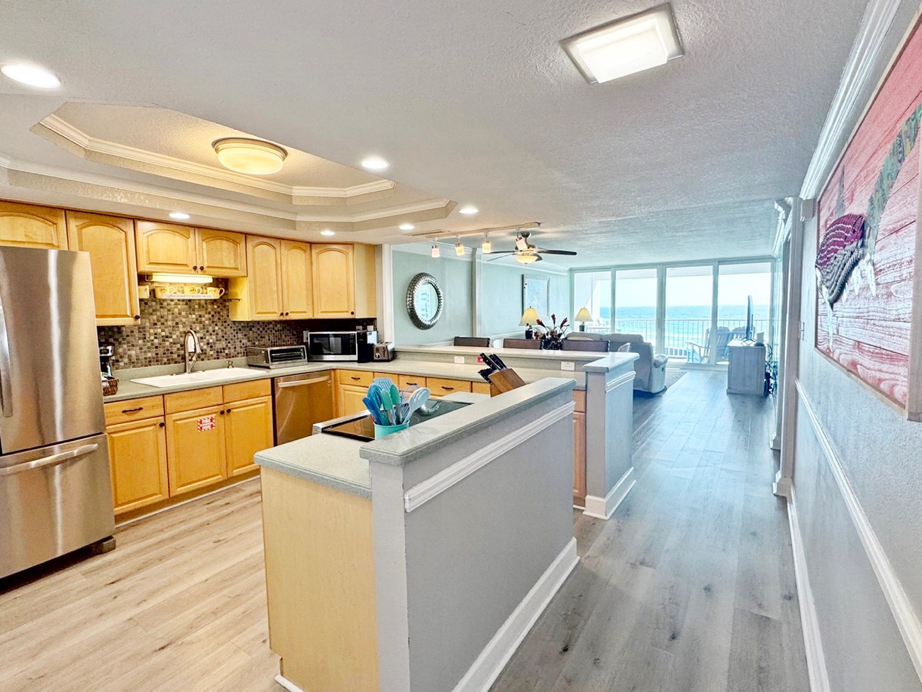 Your spacious kitchen opens to the living area, where ocean views frame every meal you'll prepare and share together.