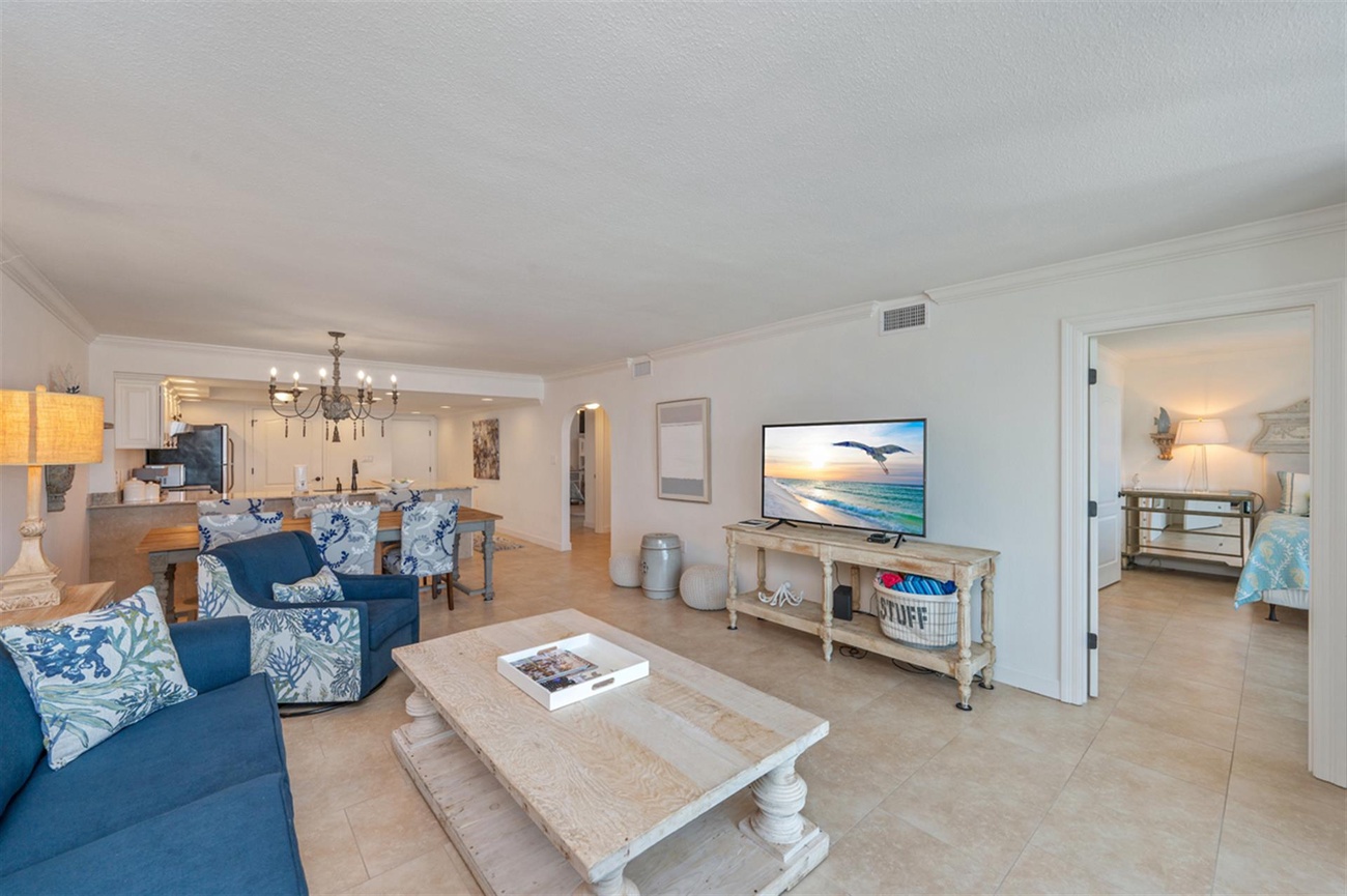 Unwind in this bright, open living space where coastal blues and whites create your perfect beach getaway atmosphere.
