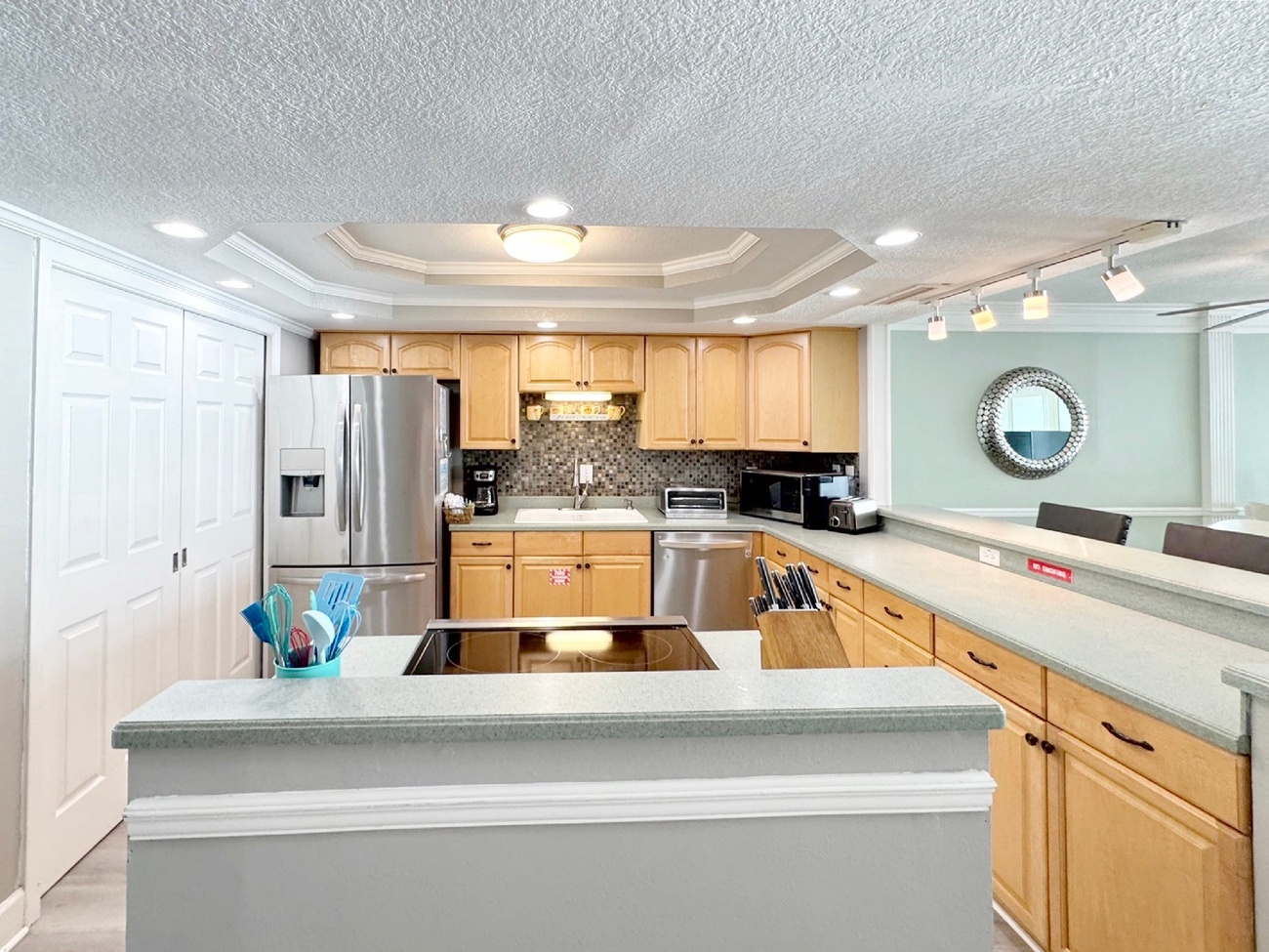 Your spacious kitchen features modern appliances, granite countertops, and an open island perfect for preparing meals and gathering together.