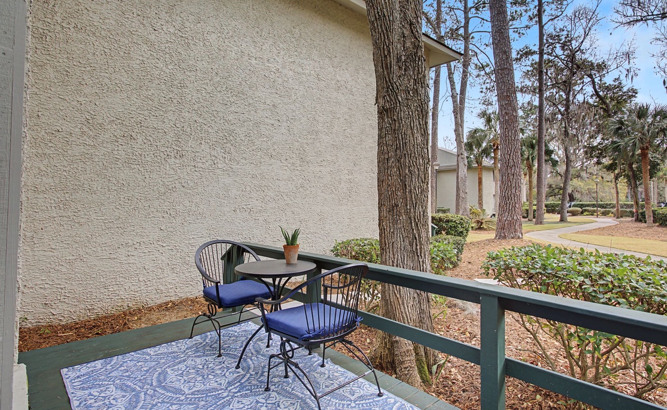 Enjoy morning coffee on your private balcony overlooking mature trees and peaceful gardens.