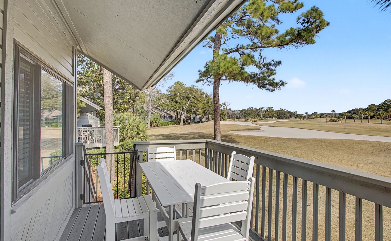 Step onto your private balcony to enjoy morning coffee with panoramic golf course views stretching beyond towering pines.
