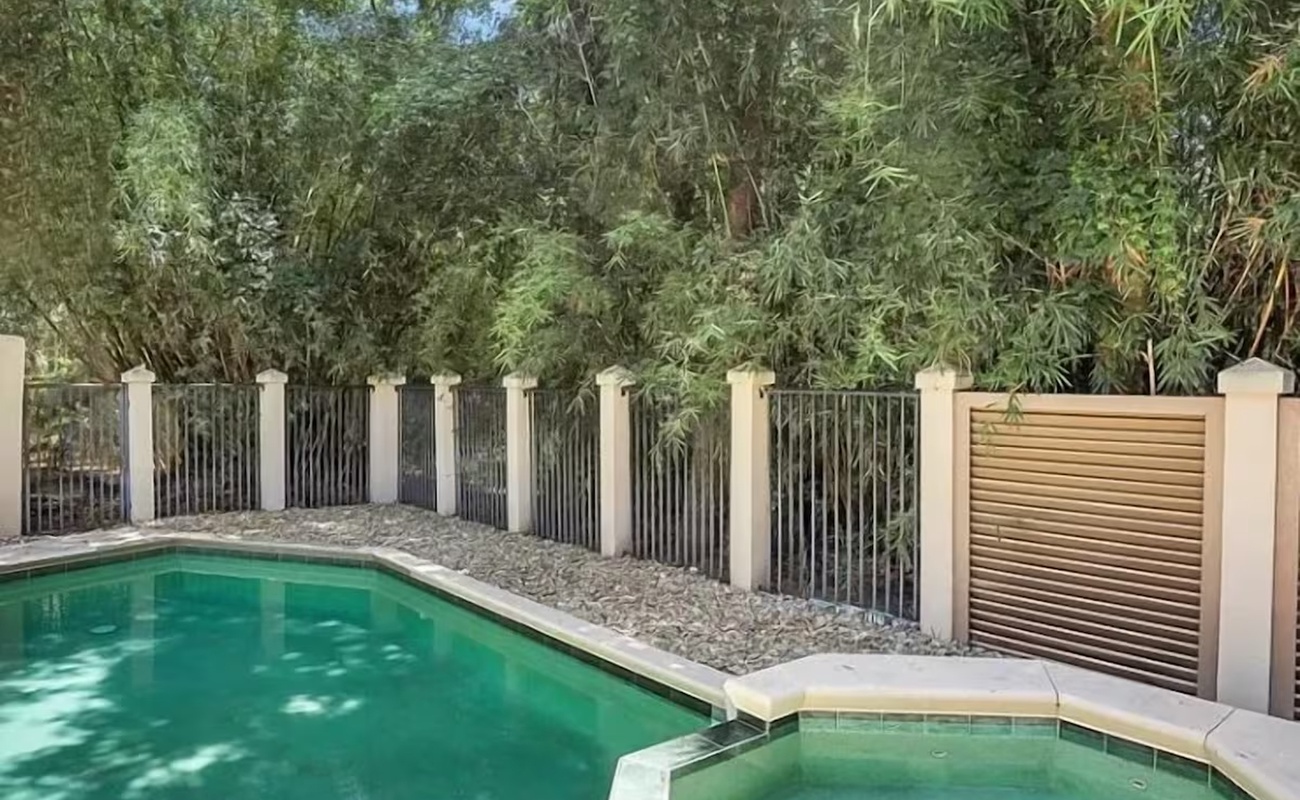 Dive into your private oasis with crystal-clear pool and spa, surrounded by lush tropical greenery for ultimate relaxation.