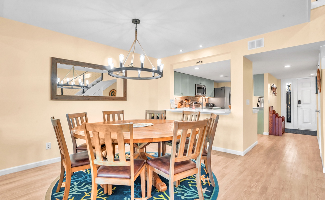 Gather around your spacious dining table for memorable meals, with the modern kitchen just steps away for easy entertaining.