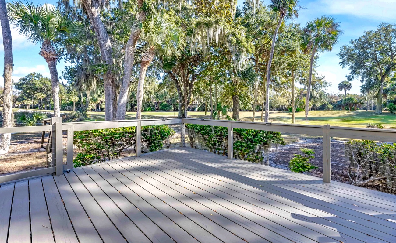 Step onto your private deck and breathe in the fresh air while taking in scenic golf course views through tropical palms.