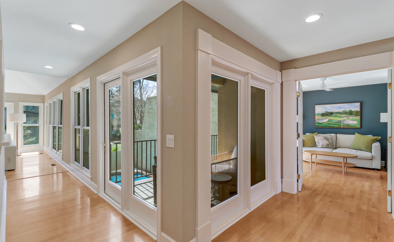 You'll love the open-concept design with gleaming hardwood floors and floor-to-ceiling windows that flood your space with natural light.