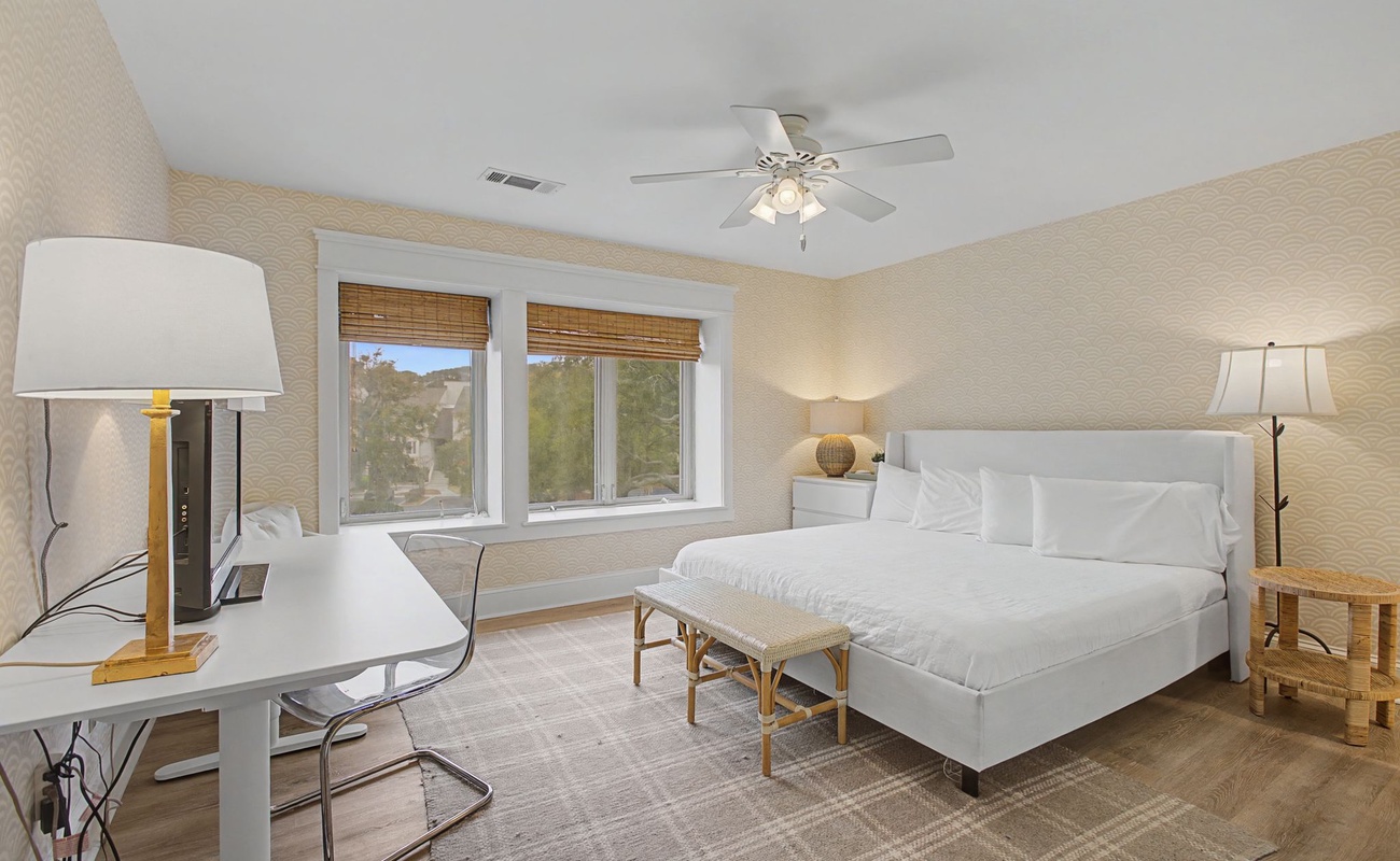 Rest peacefully in your bright bedroom with crisp linens and garden views from dual windows.
