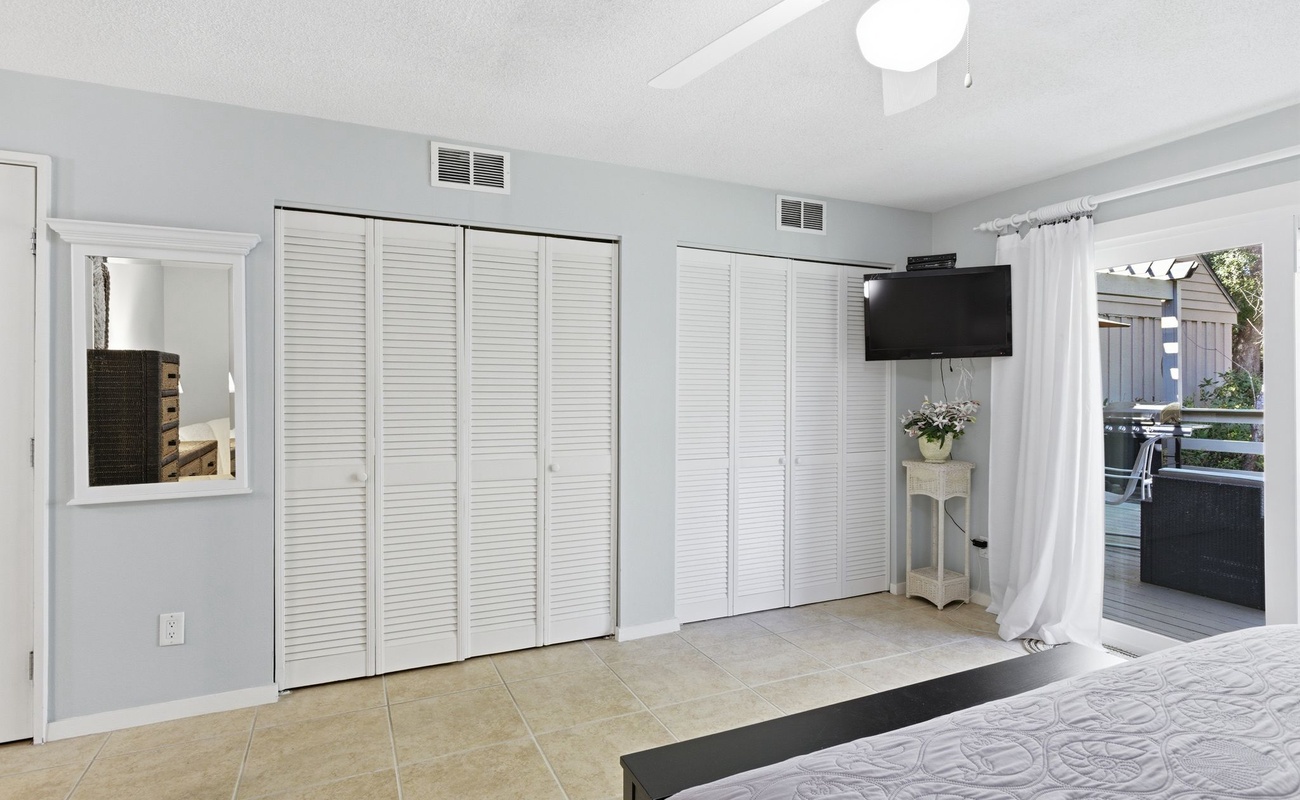 Relax in your spacious bedroom with abundant closet storage and modern amenities for a comfortable stay.