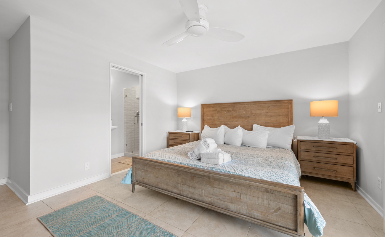 Primary Suite with King Bed, En-Suite Bathroom, and Access to Private Porch