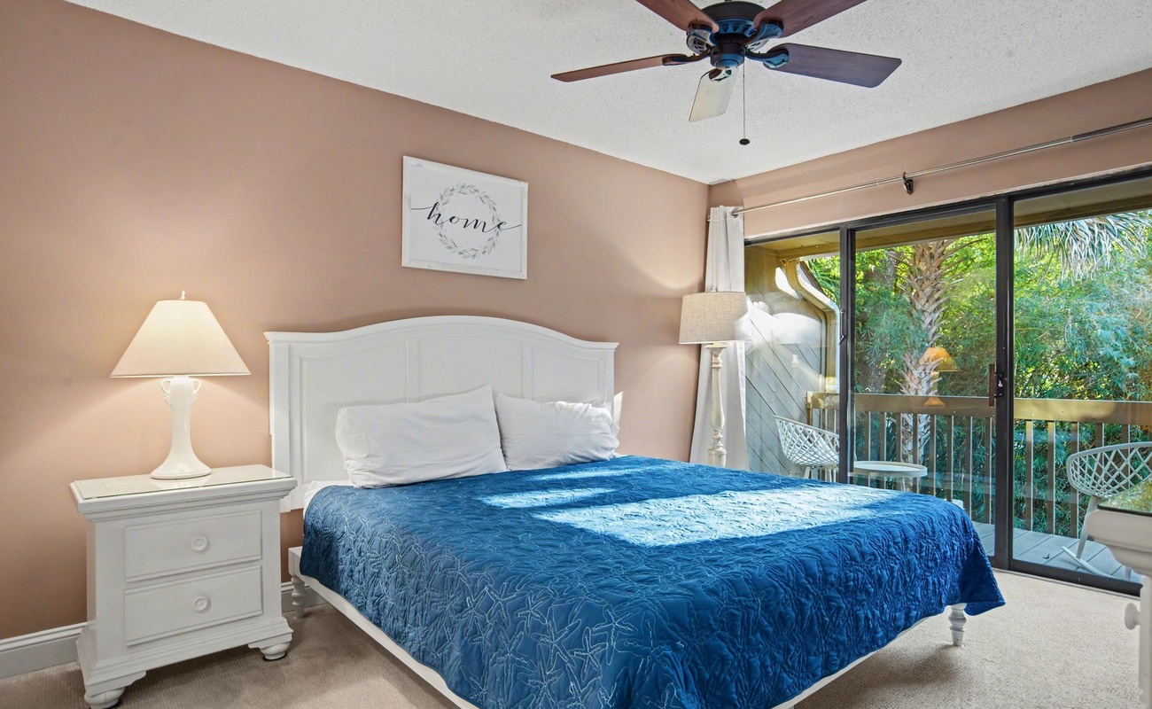 Drift off to peaceful sleep in your cozy bedroom, complete with tropical garden views and gentle ceiling fan breezes.
