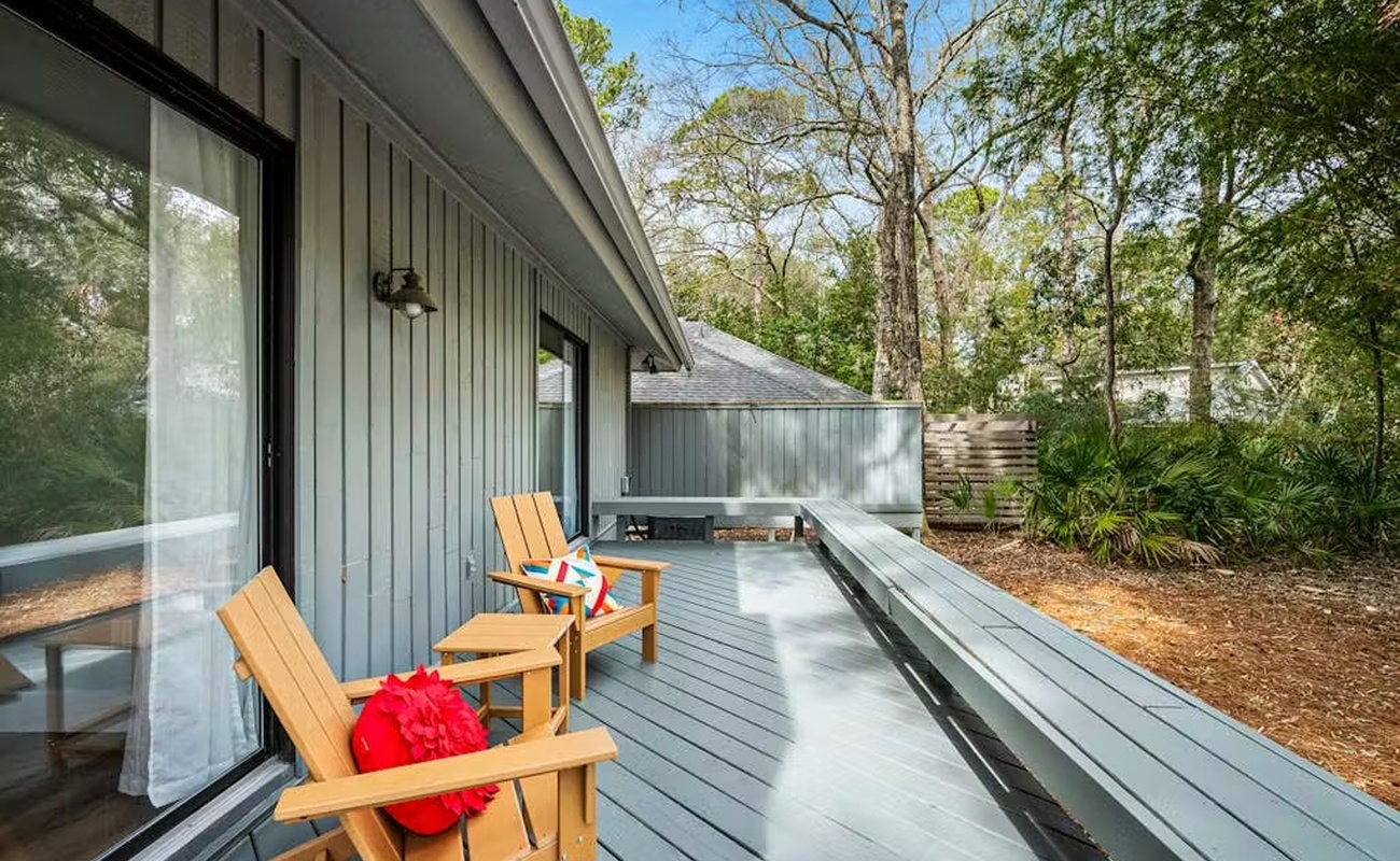 Step onto your private deck and sink into comfortable wooden chairs surrounded by peaceful trees and natural beauty.