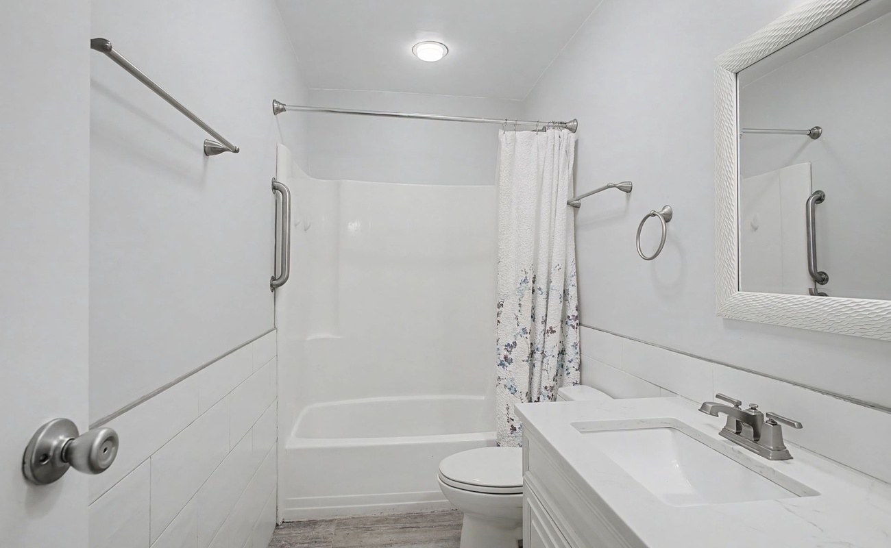 Step into your pristine bathroom with modern fixtures, grab bars for safety, and a relaxing tub-shower combo for unwinding after your adventures.