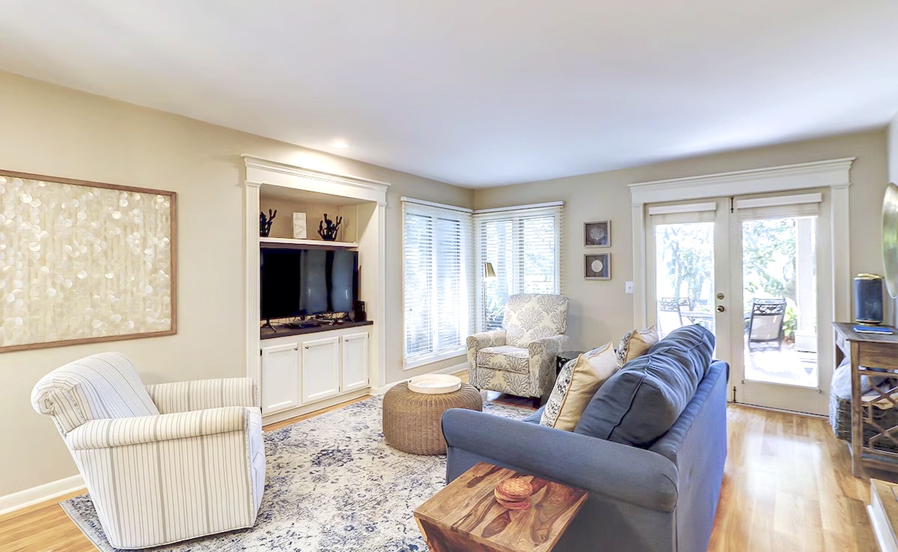 Settle into this inviting living room where plush seating and warm lighting create your perfect retreat after exploring the area.