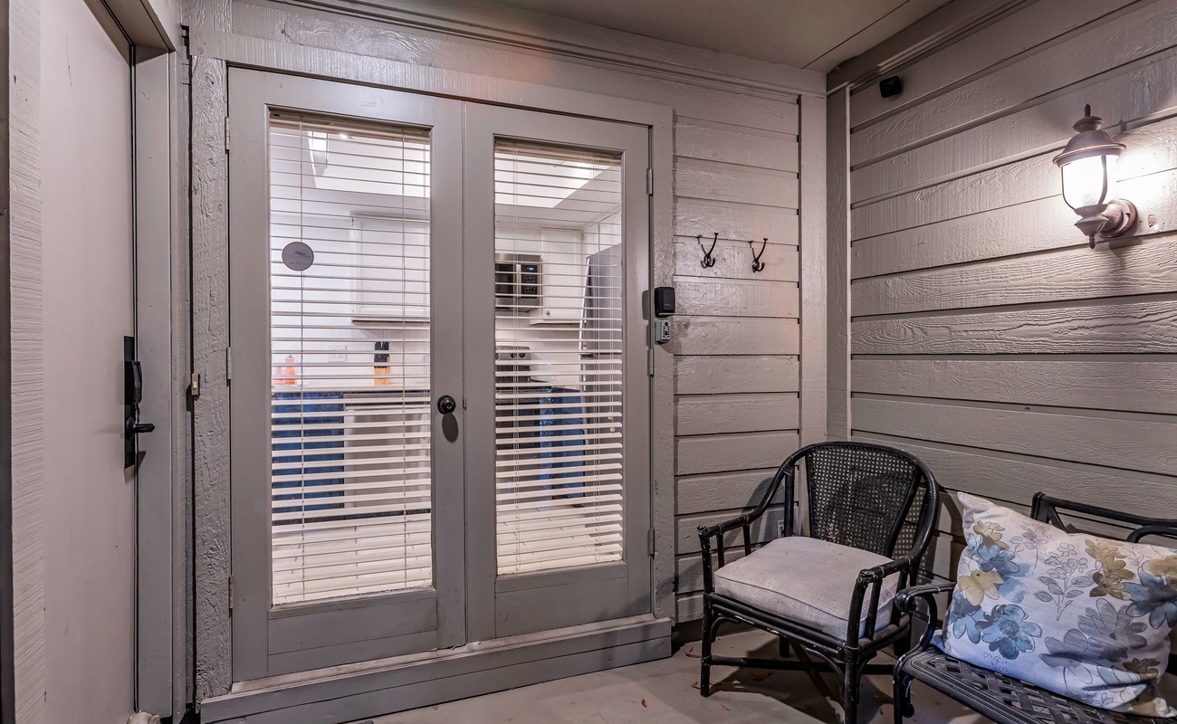 Step onto your private balcony with cozy seating where you can unwind with morning coffee or evening relaxation.