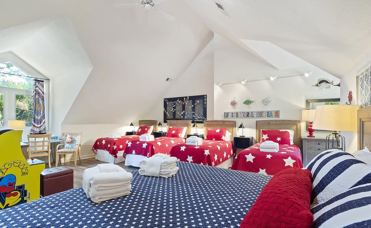 Your spacious family room features cheerful star-patterned bedding and vaulted ceilings, perfect for creating magical memories with loved ones.