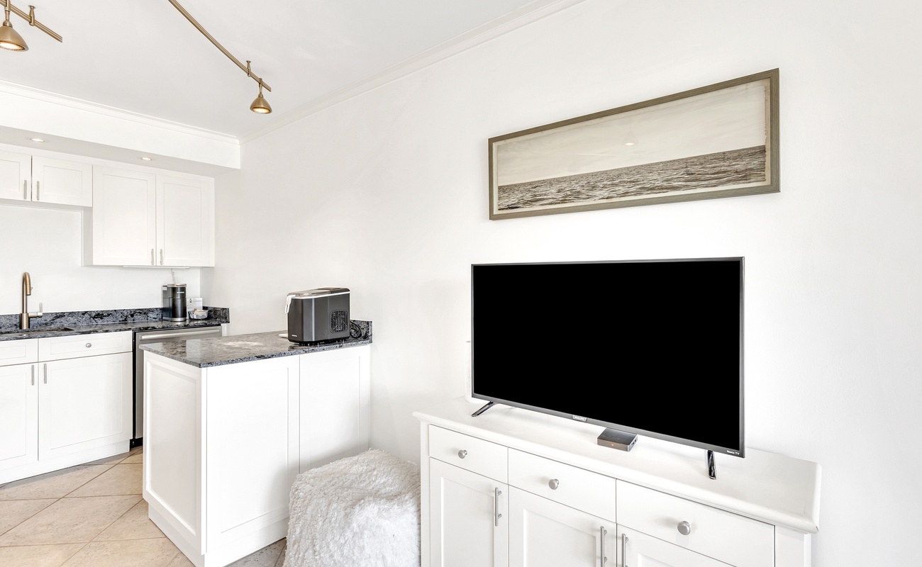 Unwind in your bright, modern space with a full kitchen and cozy living area perfect for streaming your favorite shows.