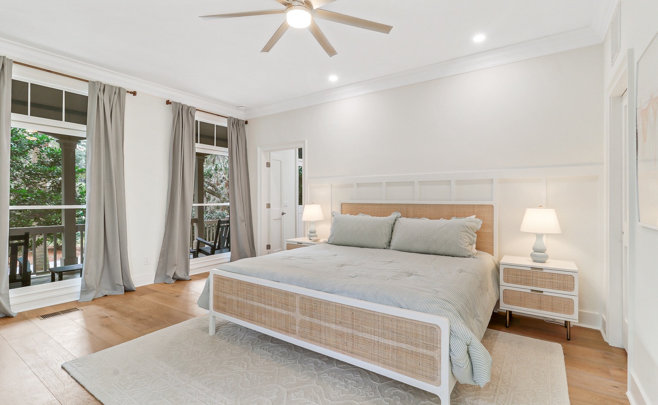 Sleep peacefully in this serene bedroom where soft linens and gentle breezes from your private balcony create the perfect retreat.