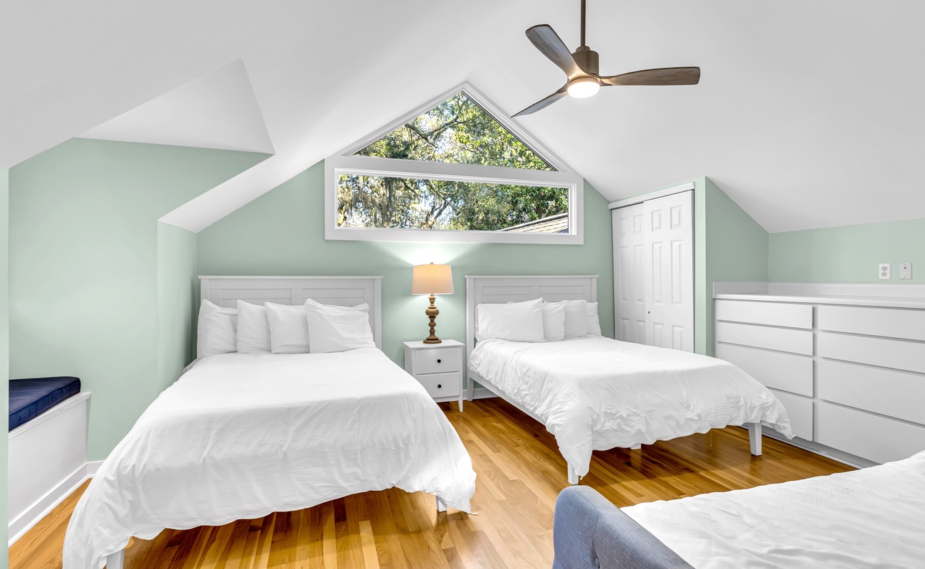 Drift off peacefully in your serene guest bedroom, where soft mint walls and crisp white linens create the perfect sanctuary for restful sleep.