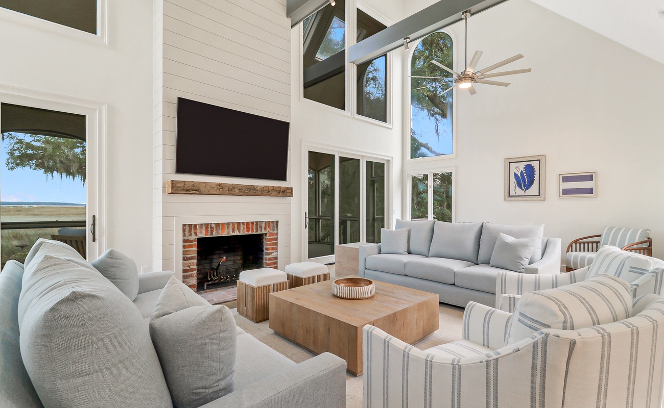 Unwind in your elegant living space featuring soaring ceilings, cozy fireplace, and stylish furnishings that invite relaxation after your adventures.