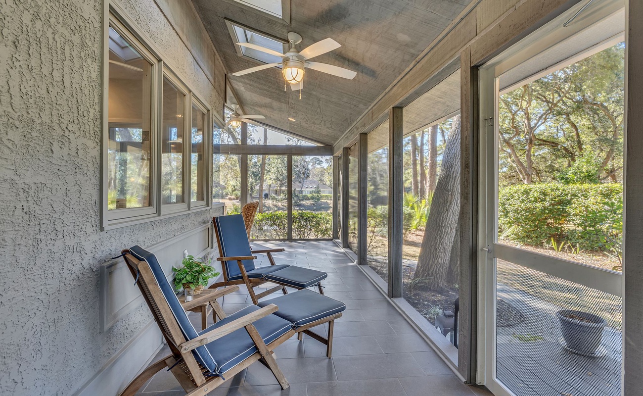 Unwind in your private screened porch with comfortable seating and peaceful garden views—perfect for morning coffee or evening relaxation.