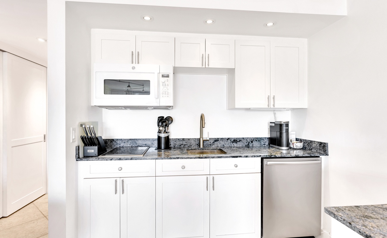 Your sleek kitchen features granite countertops, stainless steel appliances, and everything you need to prepare meals during your stay.