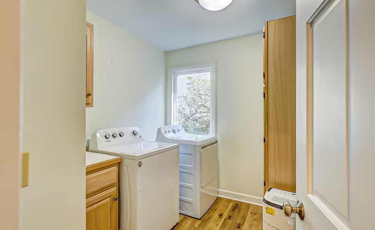 You'll appreciate the convenient in-home laundry facilities, complete with washer and dryer in this bright, well-organized space.