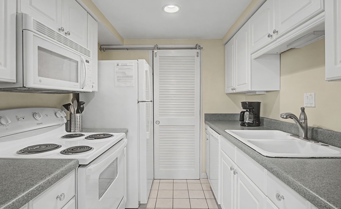 Your fully equipped galley kitchen features everything you need to prepare meals, with modern appliances and ample storage space.