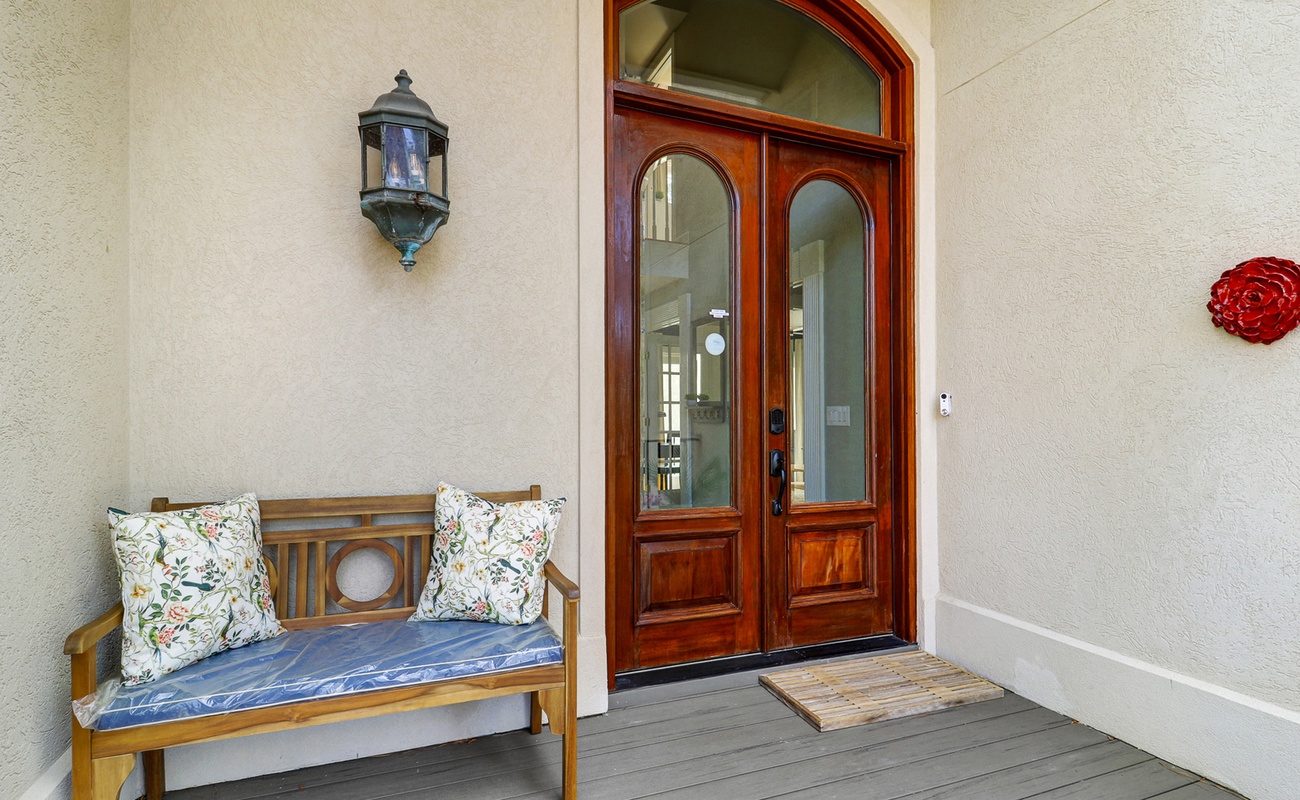 Step into elegance through these stunning glass doors, with a welcoming bench where you can pause and soak in the peaceful ambiance.