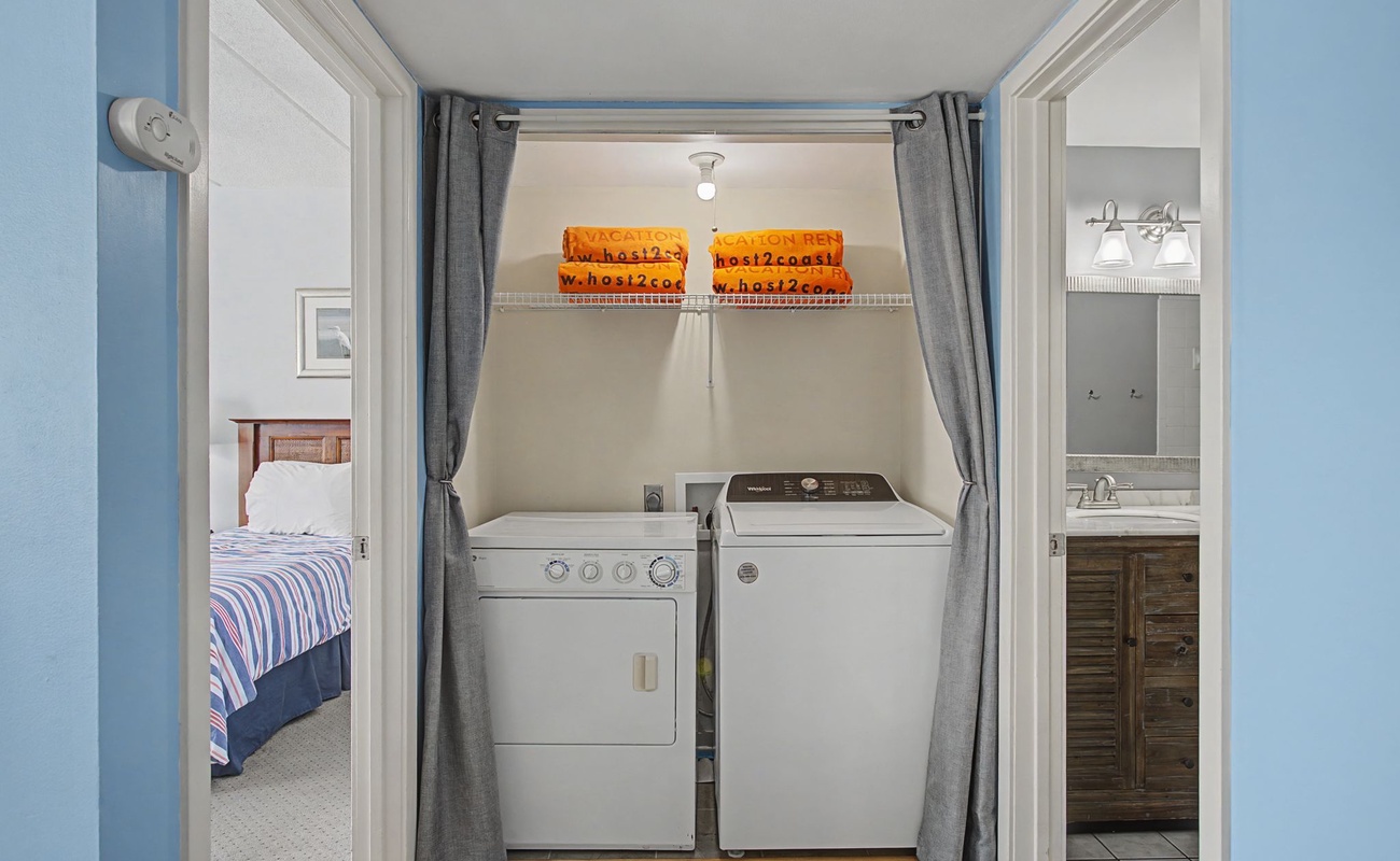 Your private laundry alcove keeps your clothes fresh, with convenient washer and dryer tucked neatly away behind soft curtains.