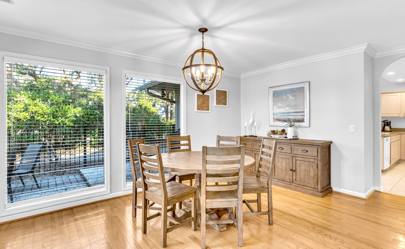 Gather around this elegant game table, where warm wood tones and beautiful natural light create the perfect setting for laughter, friendly competition, and time together.