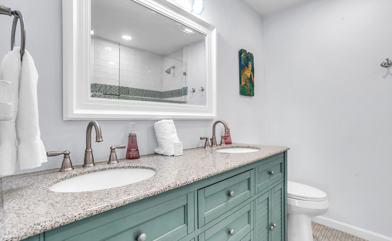 Fresh towels and dual vanities make your morning routine effortless in this bright, spa-like bathroom with modern finishes.