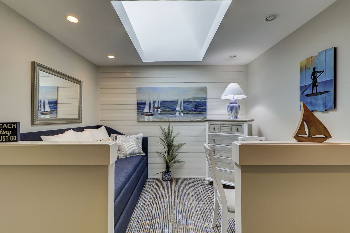 A bonus upstairs loft area adds to the charm, featuring a trundle twin bed and a cozy sitting area.