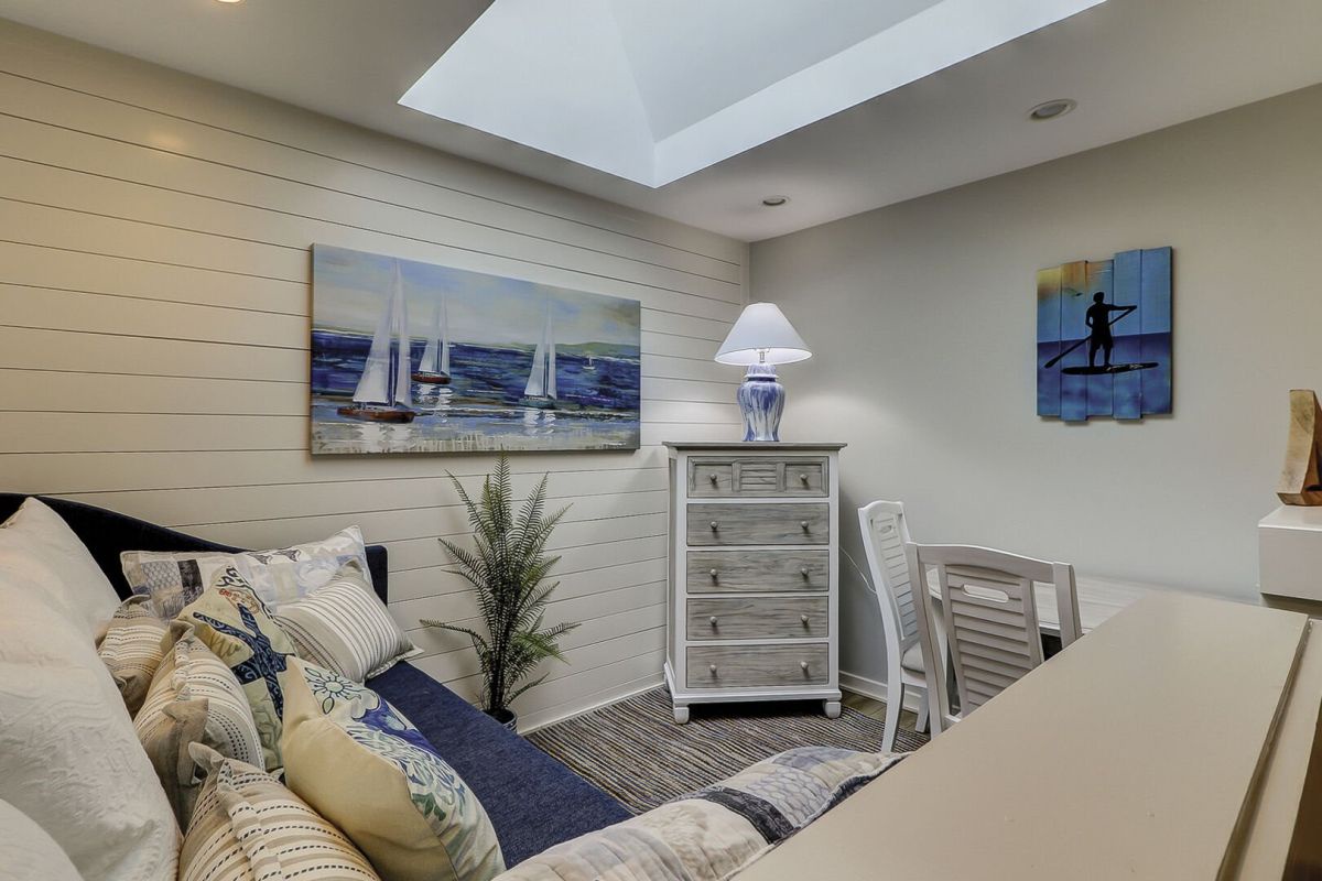A bonus upstairs loft area adds to the charm, featuring a trundle twin bed and a cozy sitting area.